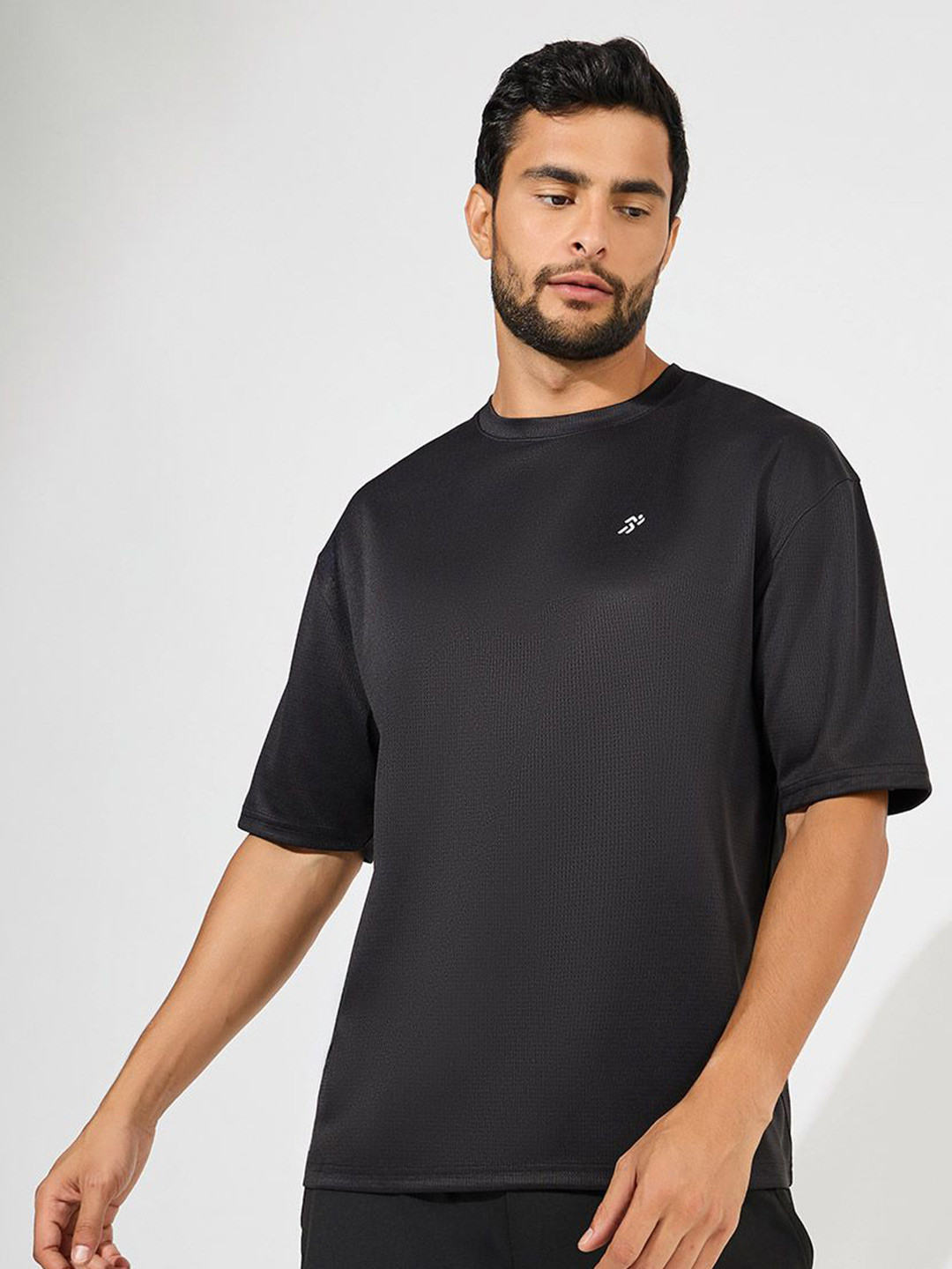 Styli Men Soft Texture Badge Detail Oversized Athleisure Tee