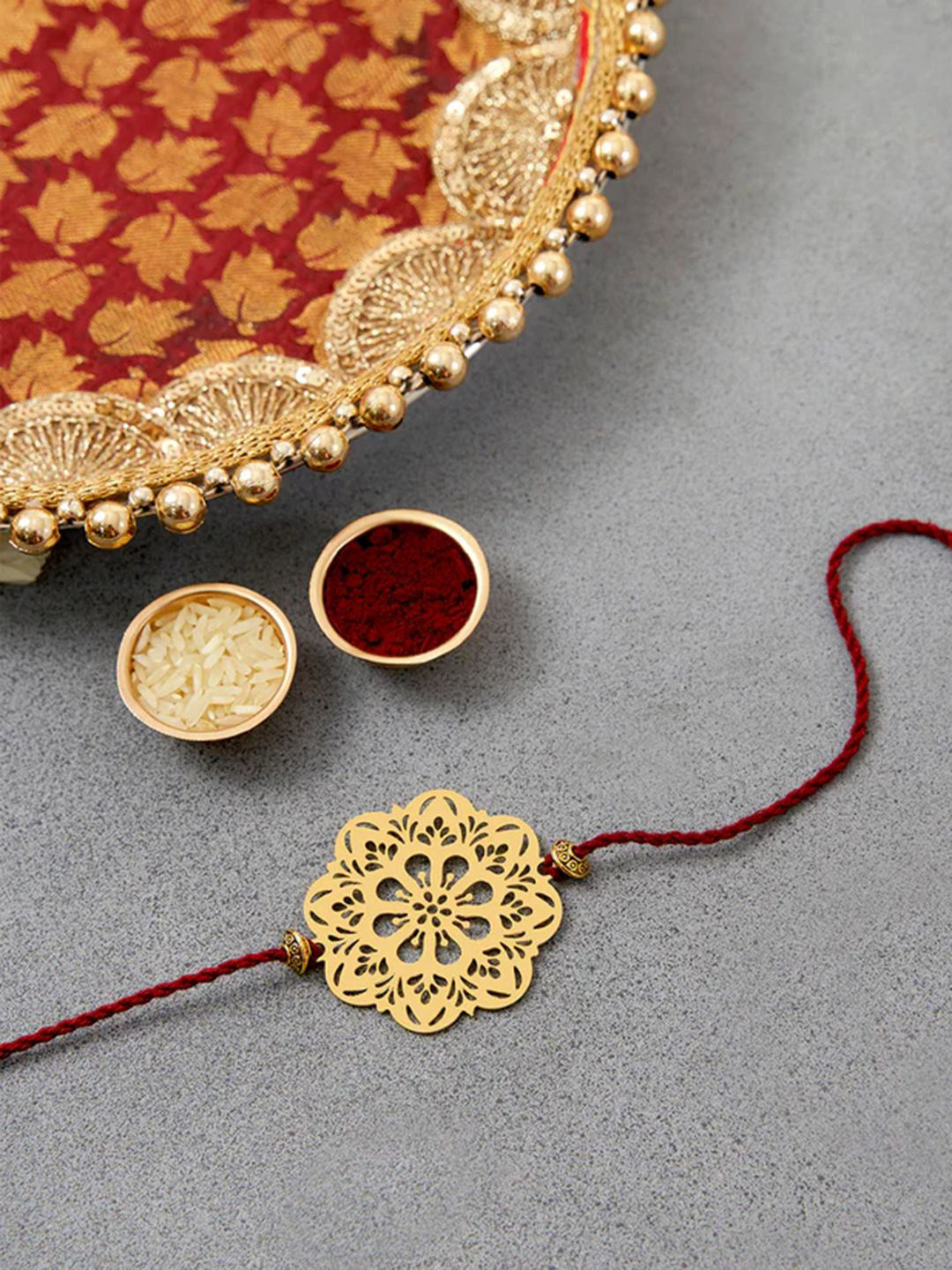 DecorTwist Brass Flower Design Rakhi with Keychain