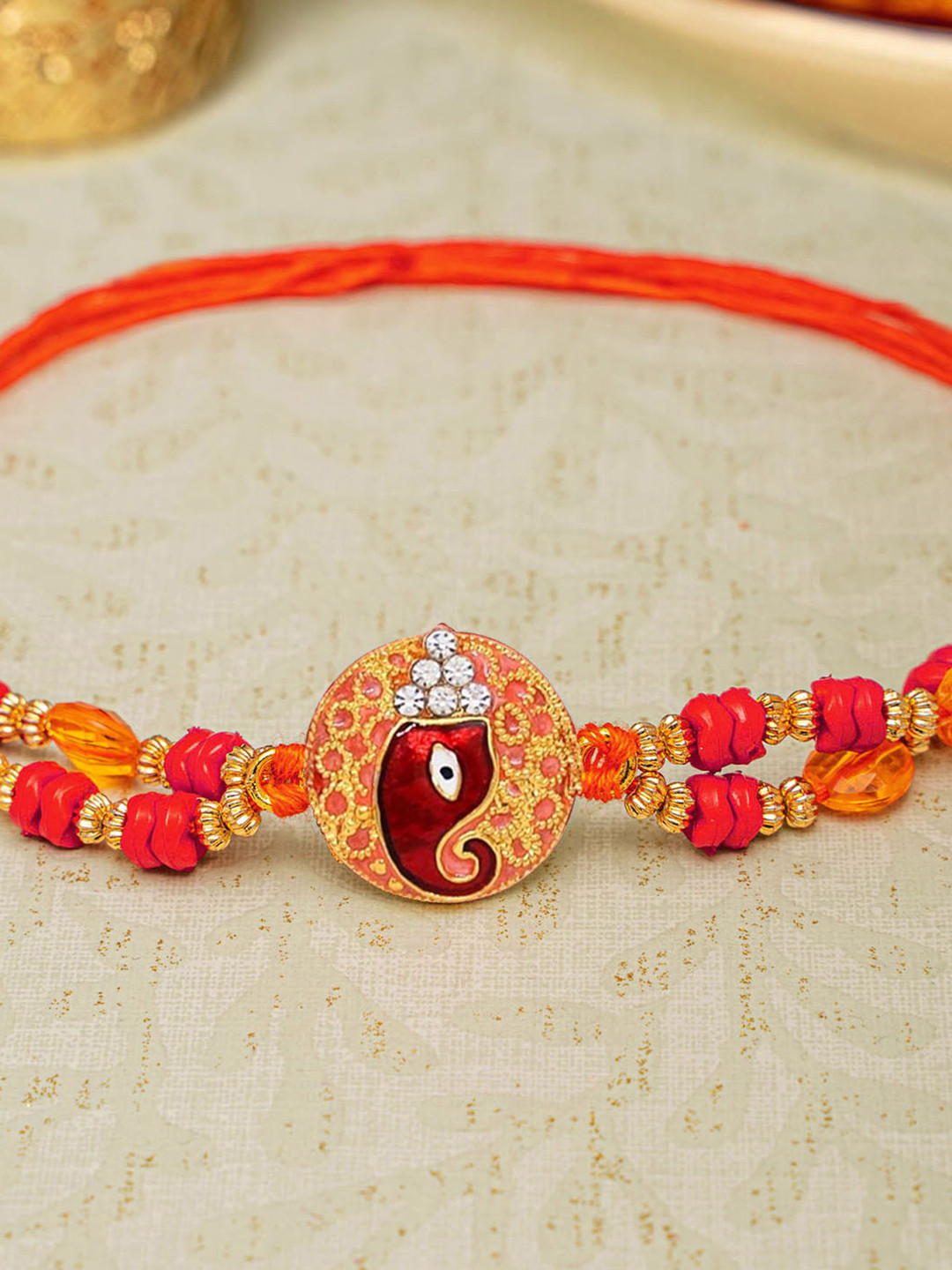 TIED RIBBONS Beaded Om Rakhi with Roli Chawal