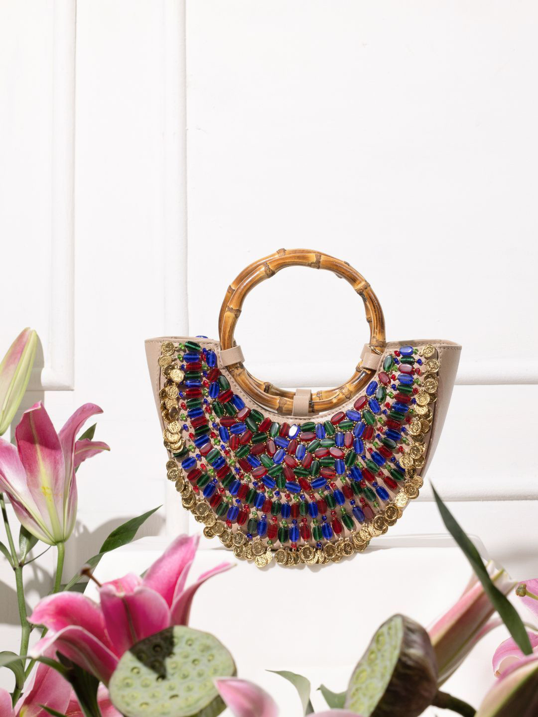 The Leather Garden Floral Leather Half Moon Handheld Bag with Tasselled