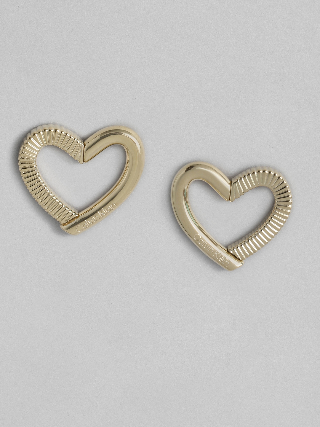 Buy Calvin Klein Minimalistic Heart Shaped Studs Earrings Earrings for Women 30111882 Myntra
