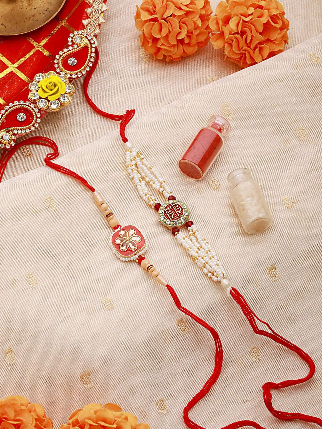 Jazz and Sizzle Set Of 2 Floral Faux Pearl Beaded And Meena Work Rakhis with Roli & Chawal