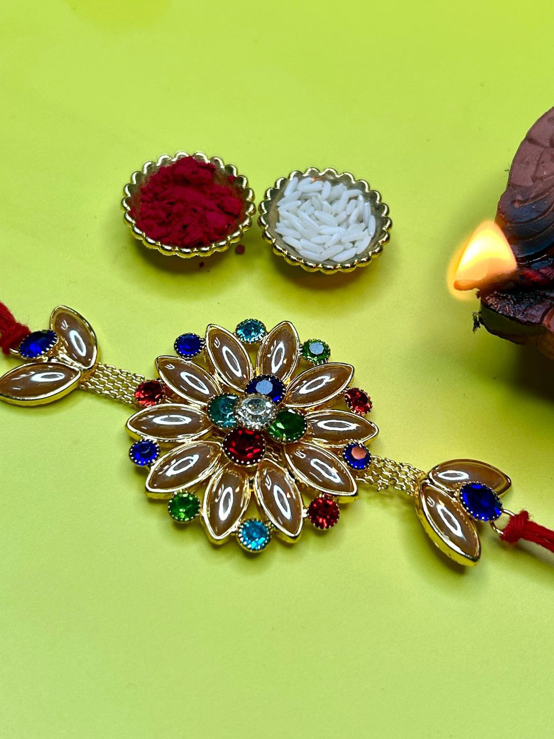LAIDA Jatayu Flower Stone Studded & Beaded Thread Rakhi With Roli Chawal