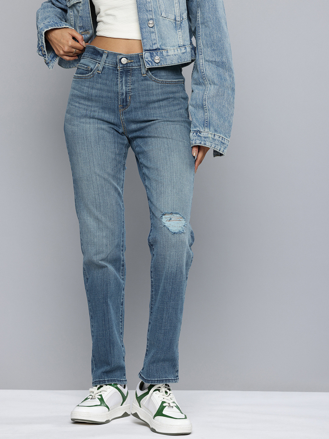 Levis Women 314 High-Rise Low Distress Light Fade Stretchable Relaxed Fit Jeans