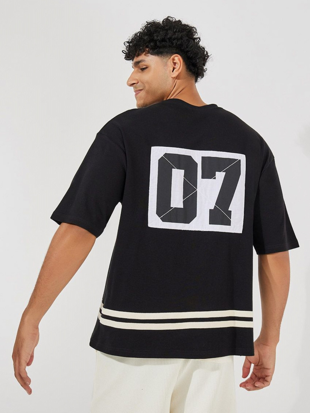 Styli Men Premium Back Printed Panel Interlock Oversized T-shirt With Striped Hem