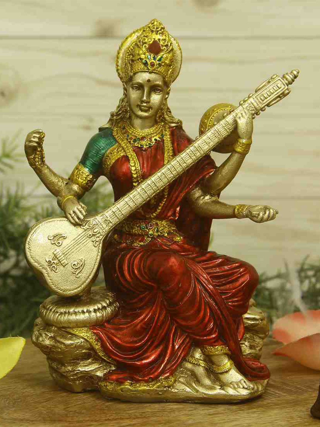 HANDICRAFTS PARADISE Red & Gold Toned Religious Saraswati Idol Showpiece