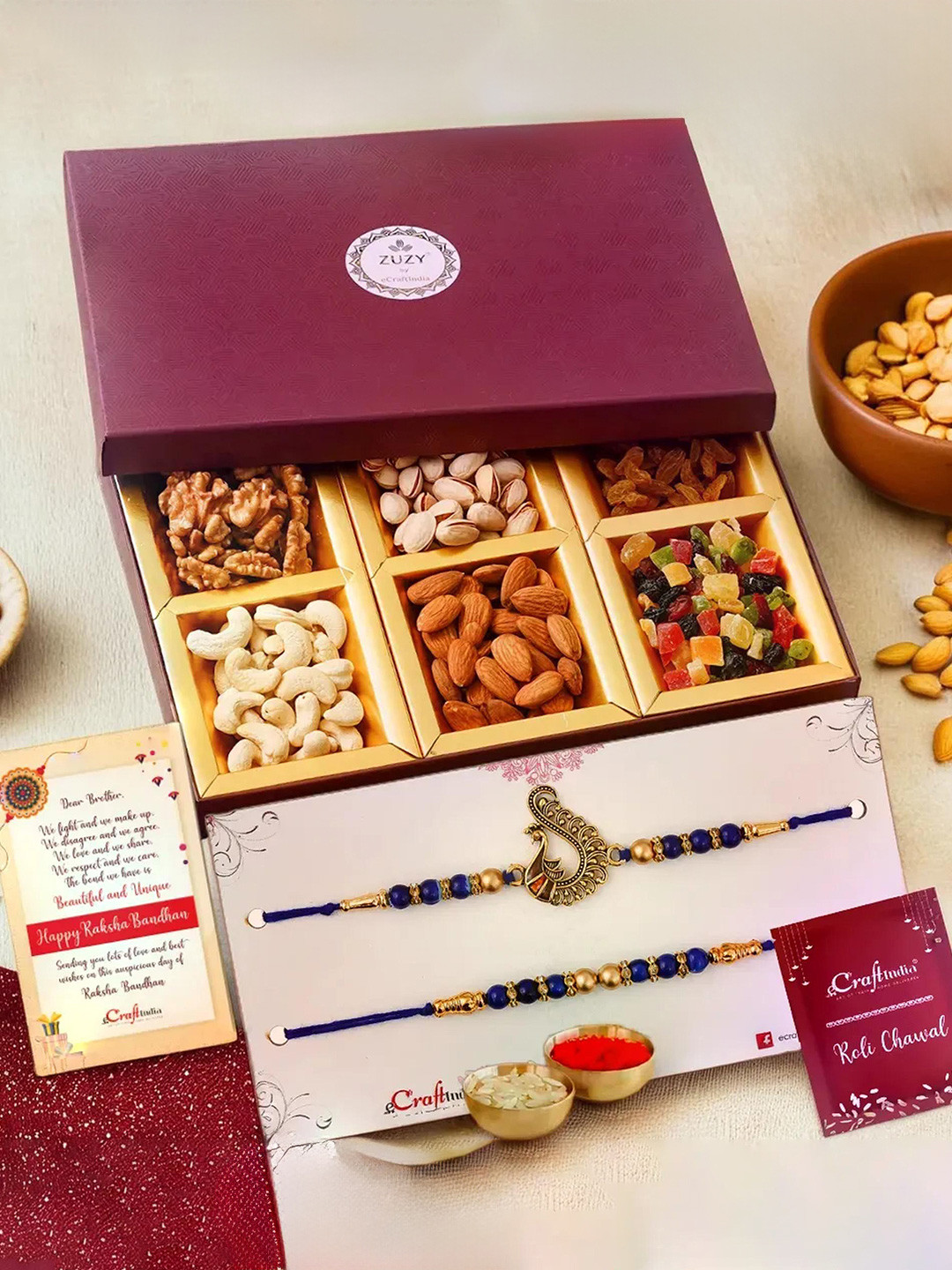 eCraftIndia Set of 3 Designer Rakhis With Zuzy Sun Dried Fruit Box and Roli Chawal Pack