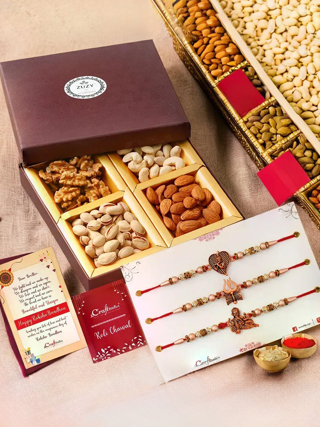 eCraftIndia Set of 4 Designer Rakhis With Zuzy Sun Dried Fruit Box and Roli Chawal Pack