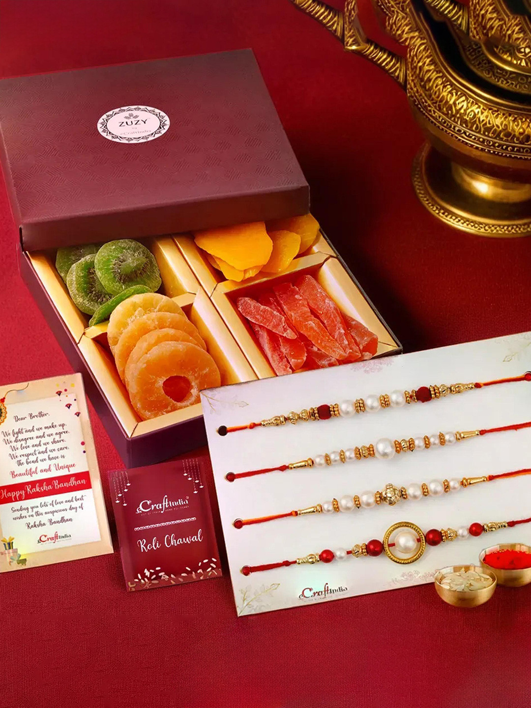 eCraftIndia Set of  Designer Rakhis With Zuzy Sun Dried Fruit Box and Roli Chawal Pack