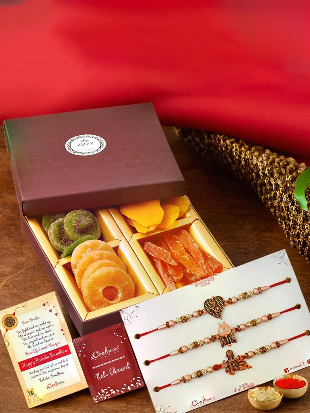 eCraftIndia Set of 4 Designer Rakhis With Zuzy Dried Fruit Box and Roli Chawal Pack