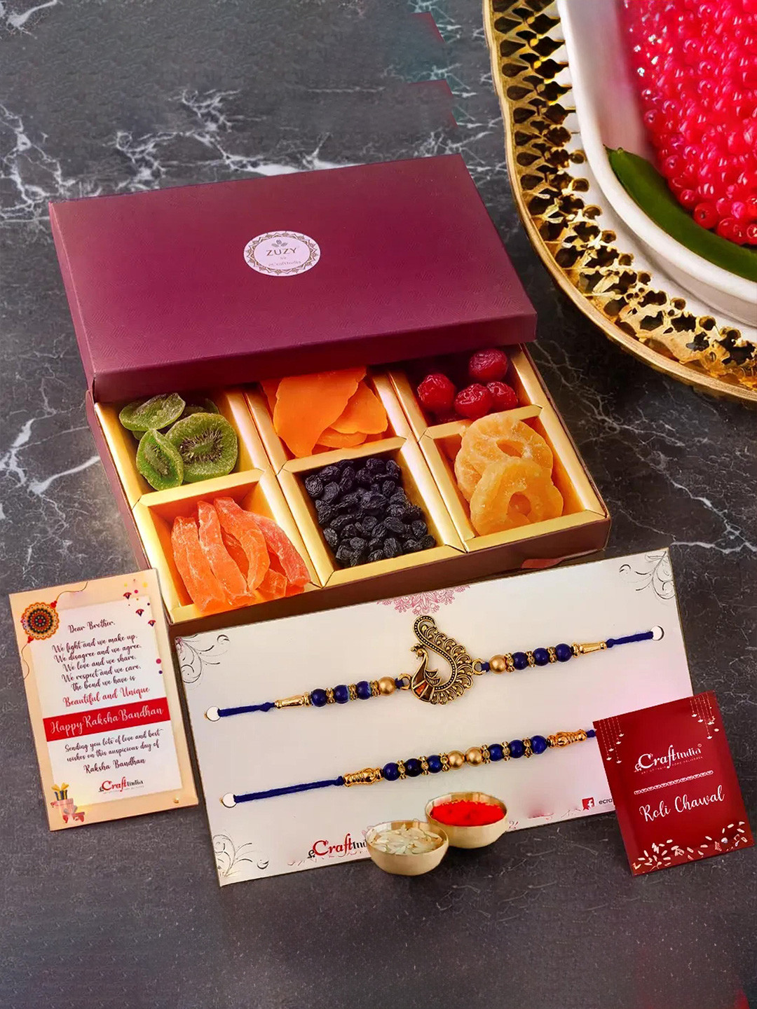 eCraftIndia  Set of 3 Peacock Rakhis With Zuzy Sun Dried Fruit Box and Roli Chawal Pack