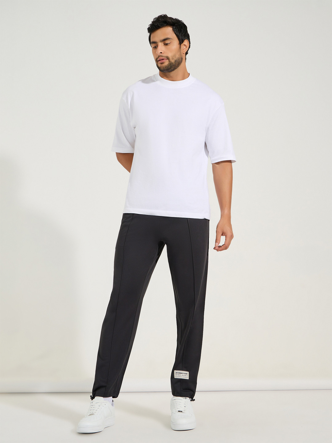 Styli Men Ultra Soft Slim Pintuck Athleisure Joggers with Badge Detail