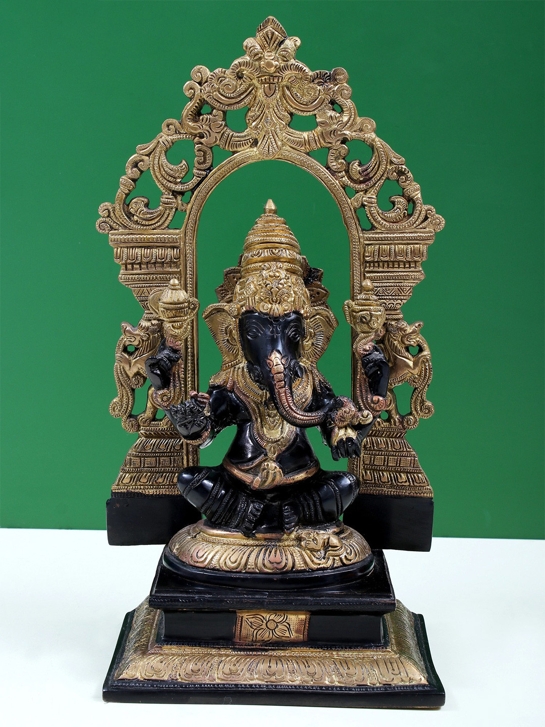 Exotic India Sitting Lord Ganesha Gold Brass Metallic Prayer Room Medium Showpiece - 12.8 Inches