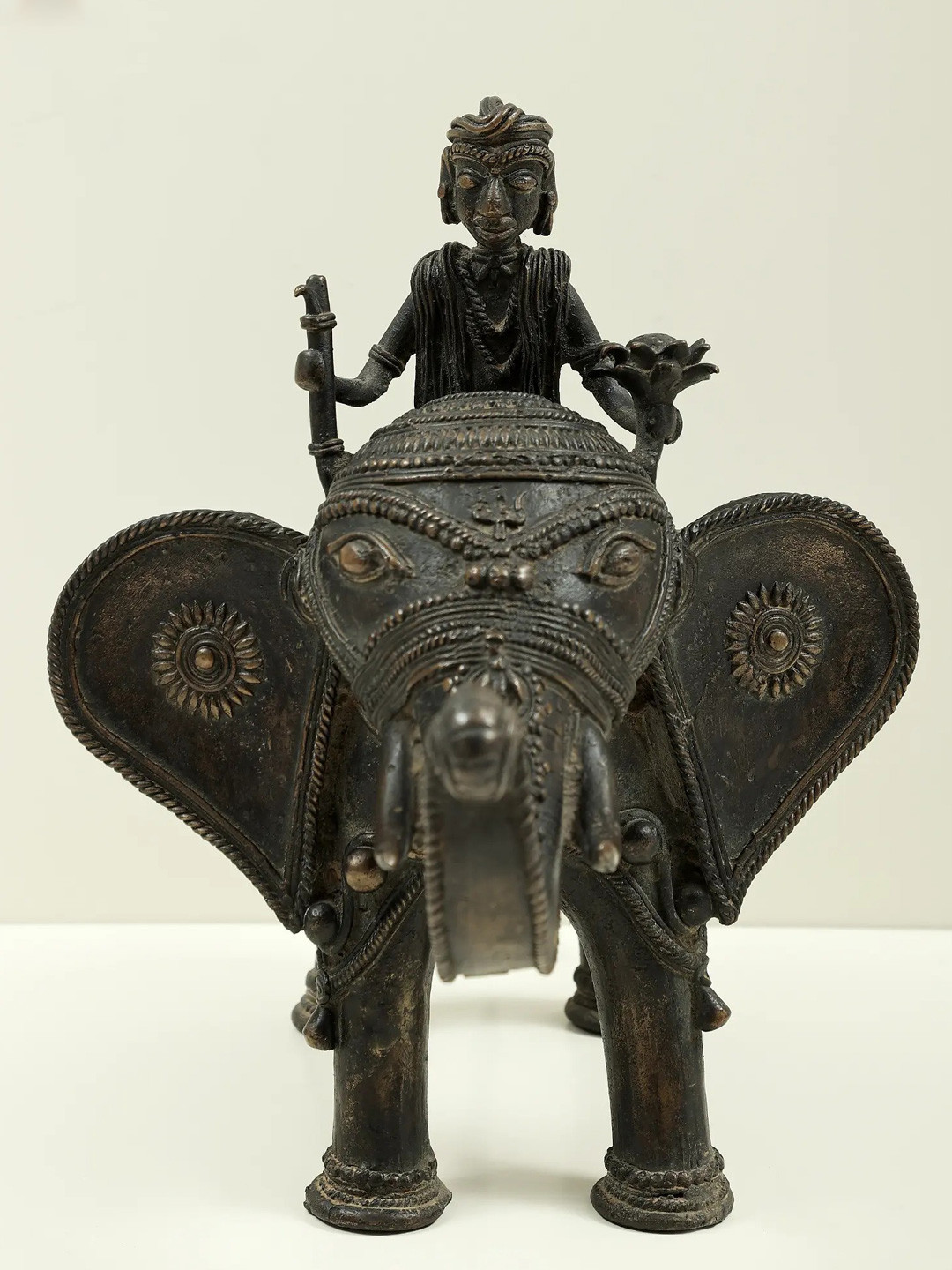 Exotic India Tribal Man Seated On Elephant Black Brass Metallic Living Room Medium Showpiece - 10.5 Inches