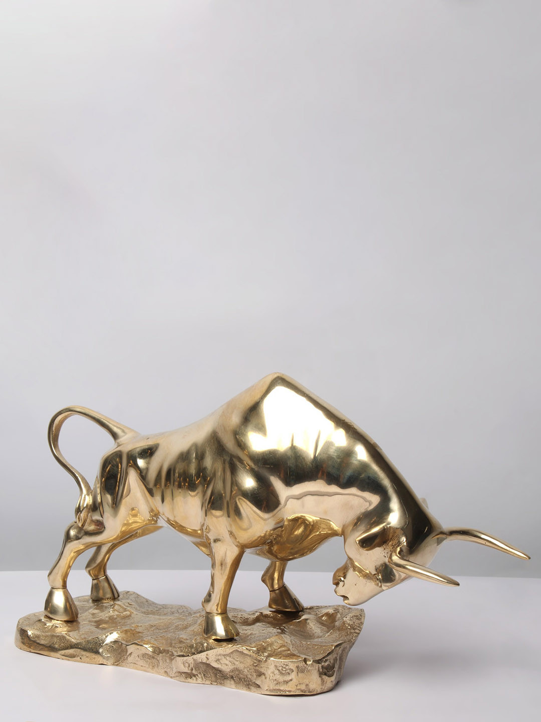 Exotic India Attacking Angry Bull Gold Brass Metallic Living Room Small Showpiece - 8 Inches