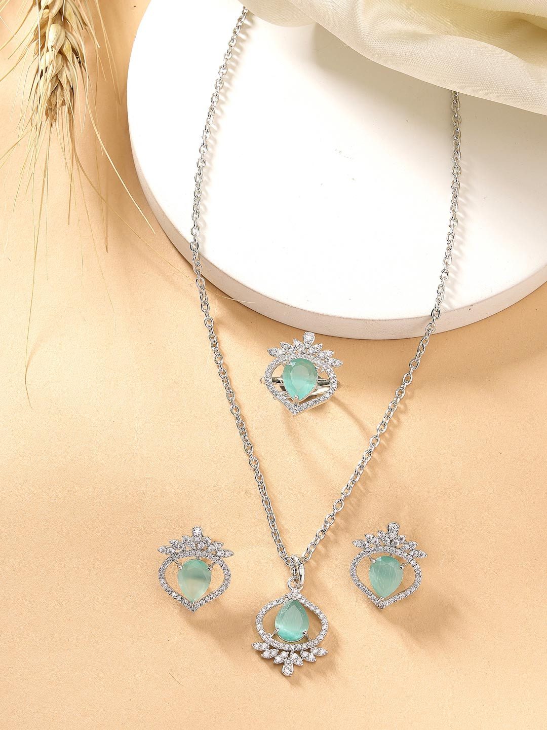 ZENEME Rhodium Plated Silver toned Sea Green AD Studded Pendant Set with Earrings And Ring