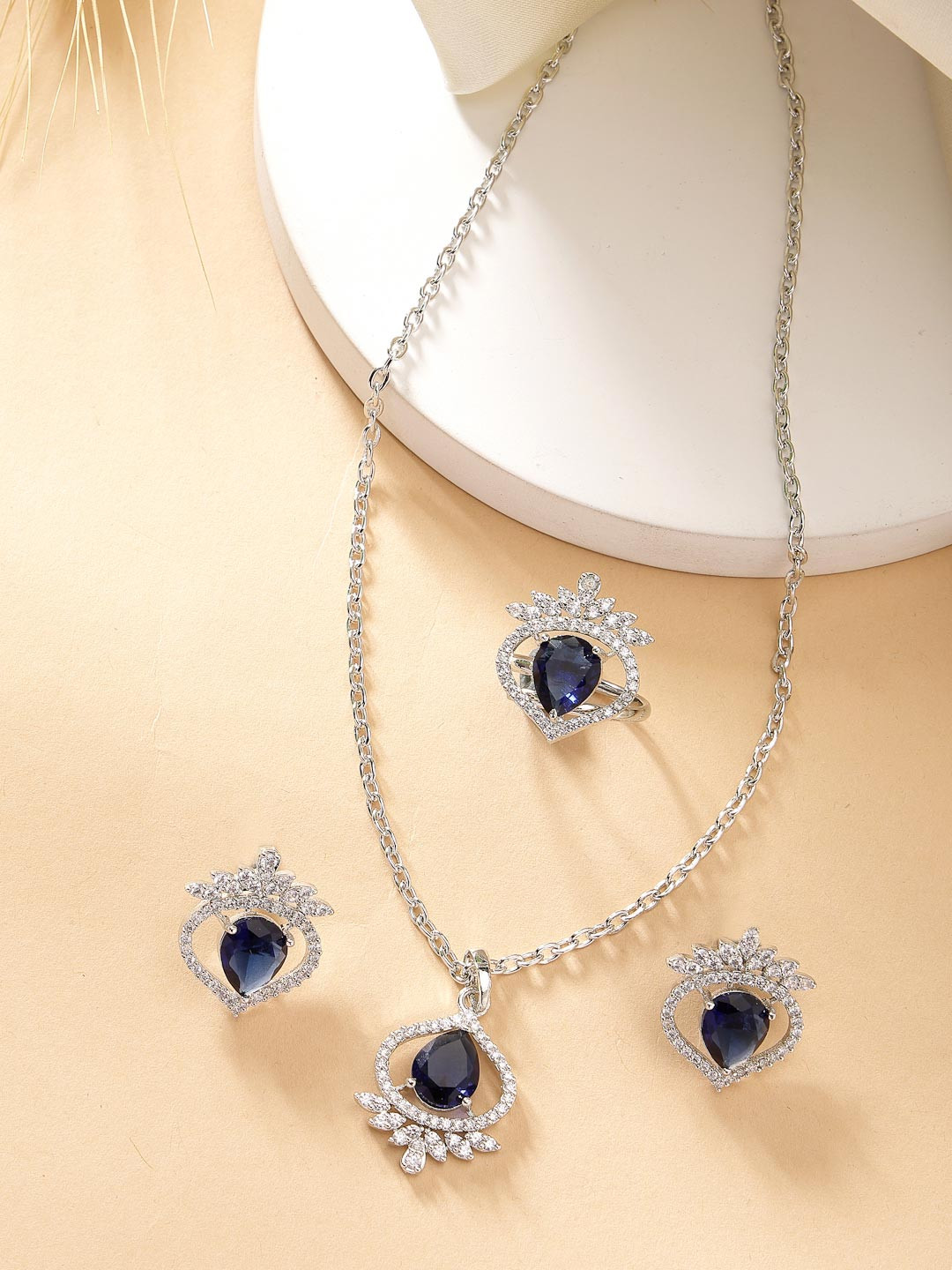 ZENEME Rhodium Plated Silver toned Blue AD Studded Pendant Set with Earrings And Ring