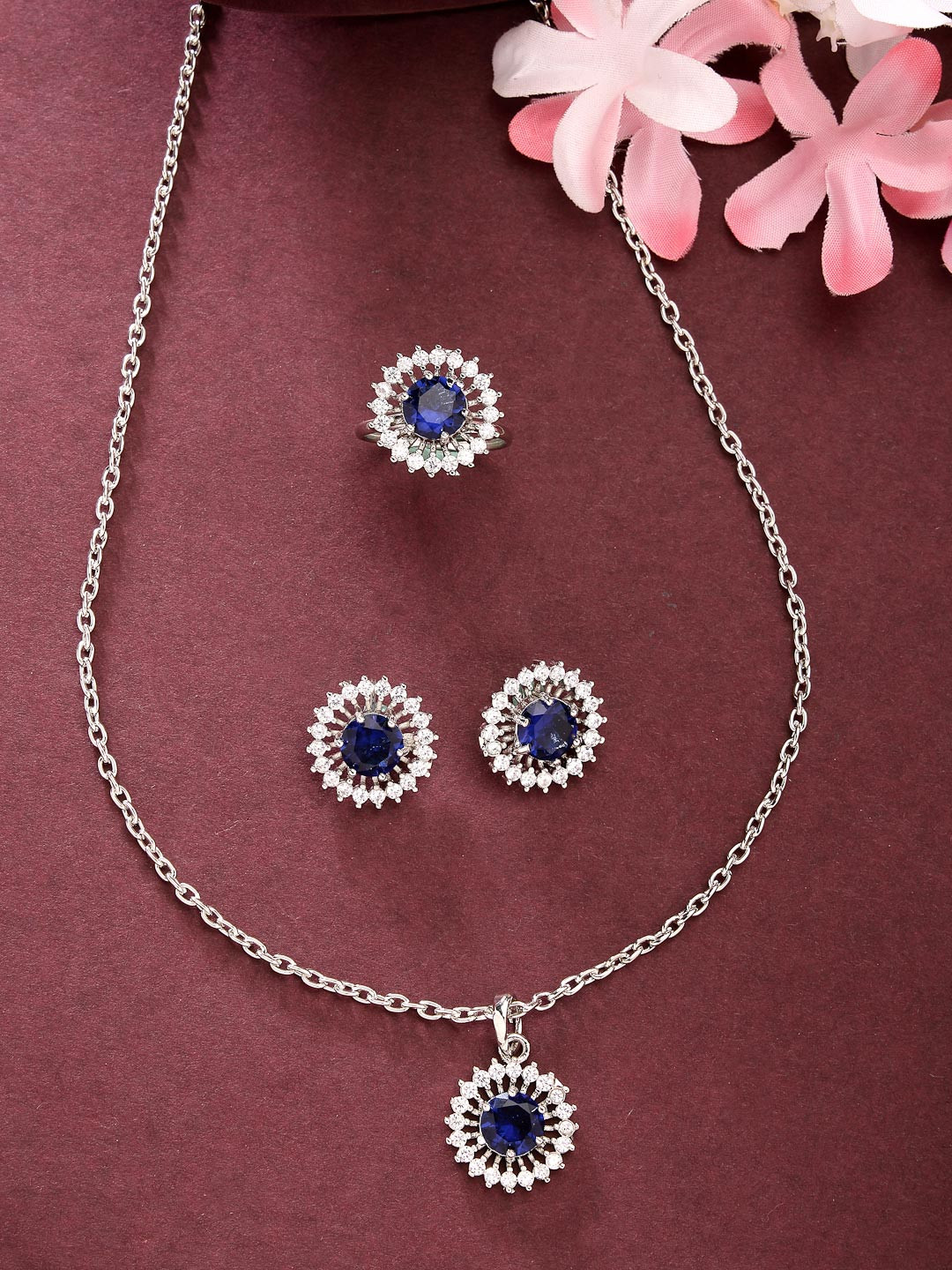 ZENEME Rhodium Plated Silver toned blue AD studded Pendant Set with Earrings & Ring