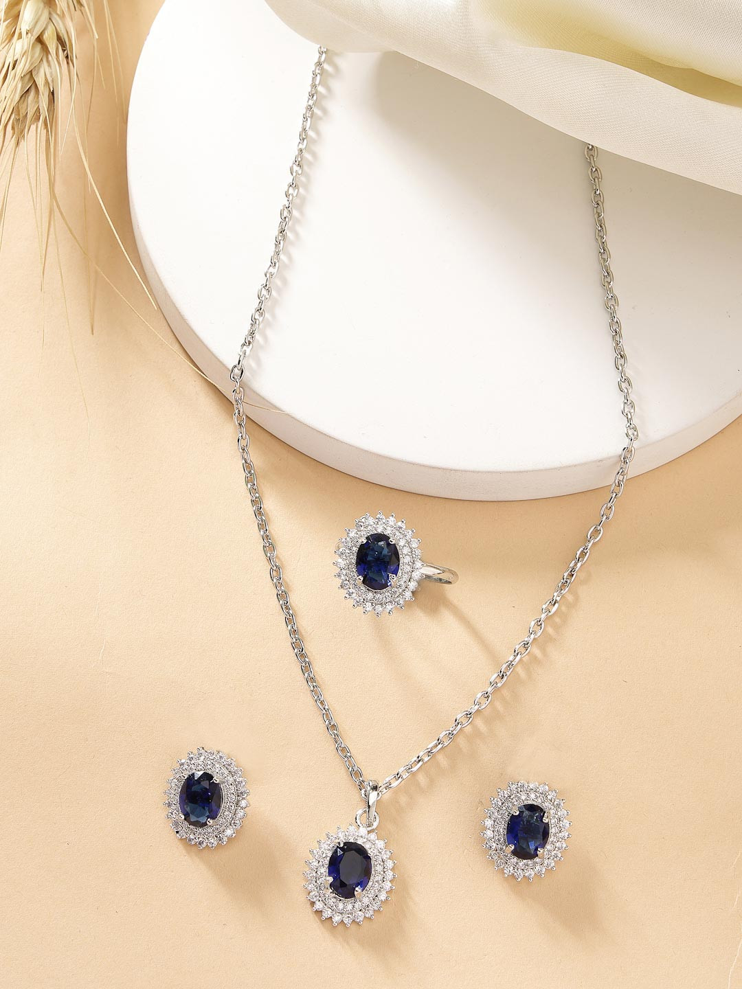 ZENEME Rhodium Plated Silver toned Blue AD Studded Pendant Set with Earrings & Ring