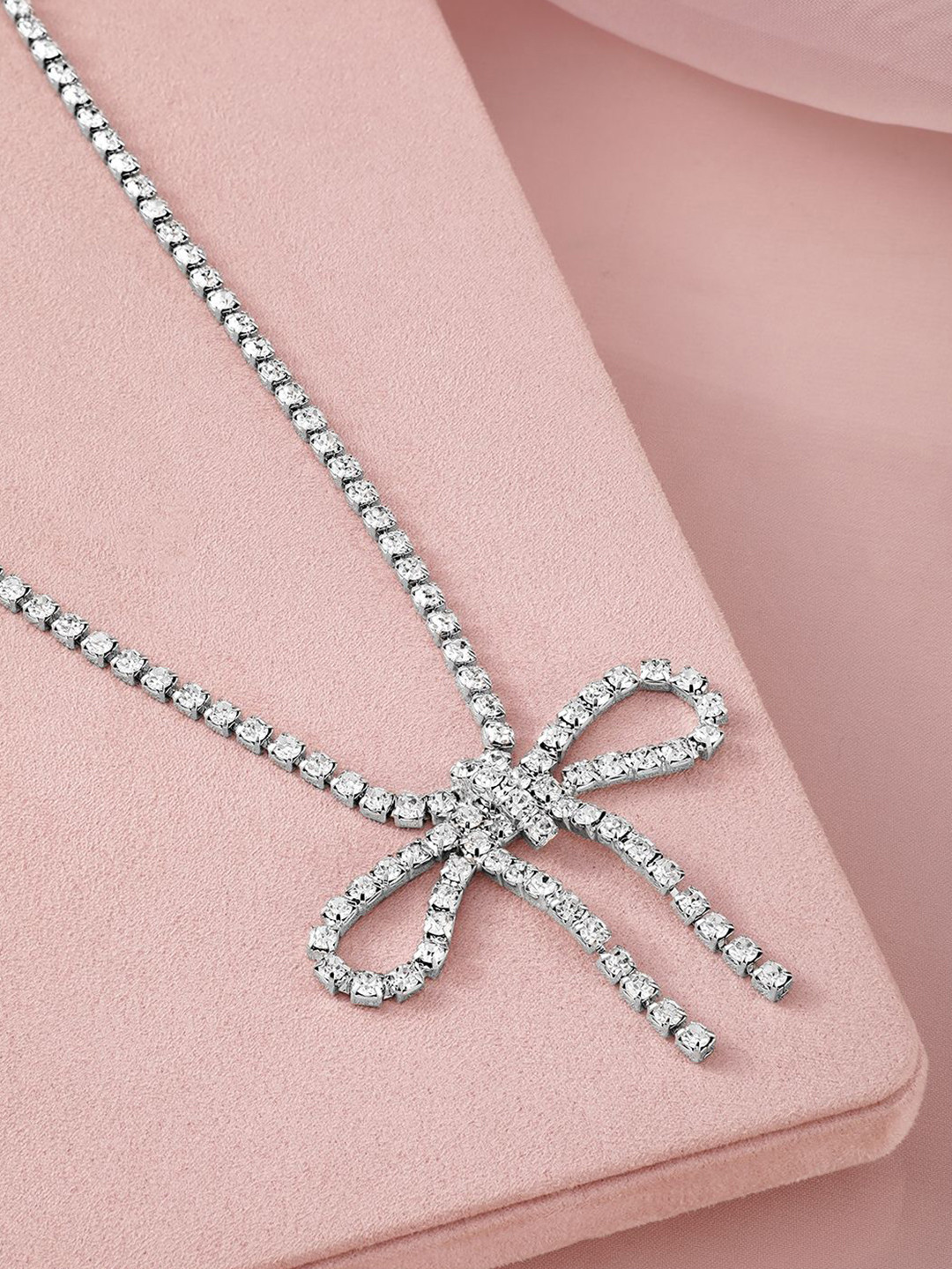 Rubans Rhodium Plated Cubic Zirconia Studded Statement Glamorous Bow Pendant Necklace