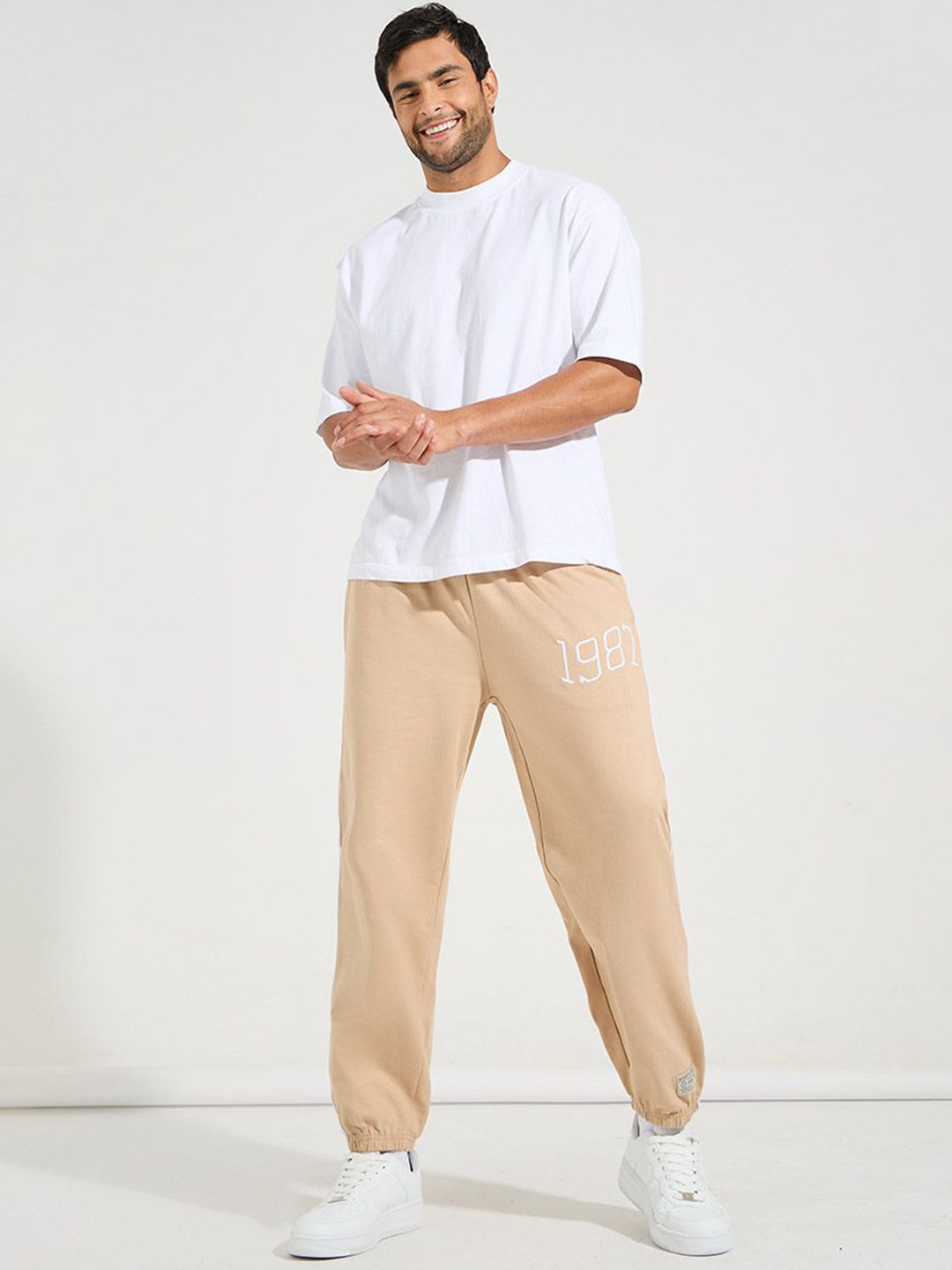 Styli Men Beige Relaxed Fit Pure Cotton Terry Jogger With Side Cord And Embroidery Detail