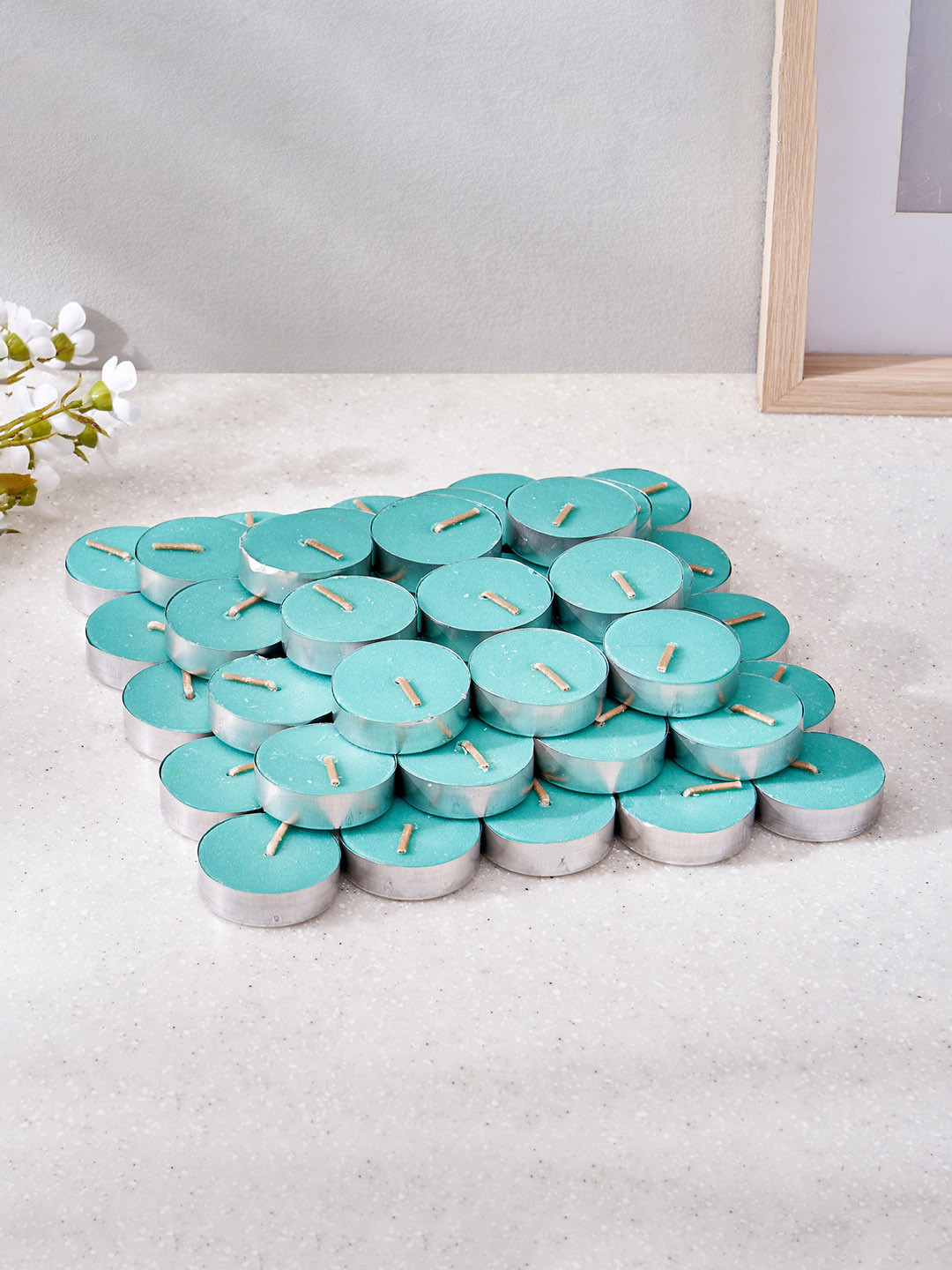 Home Centre Luminescent 50Pcs 1 Wick Sea Breeze Solid Round Regular Tea Light Candles