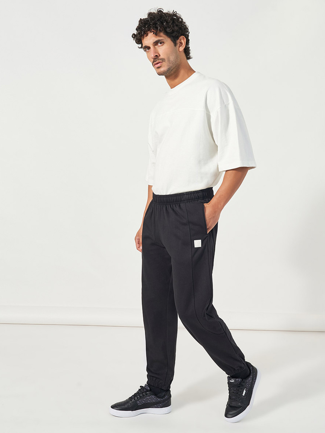 Styli Men Relaxed Fit Jogger with Seam and Badge Detail