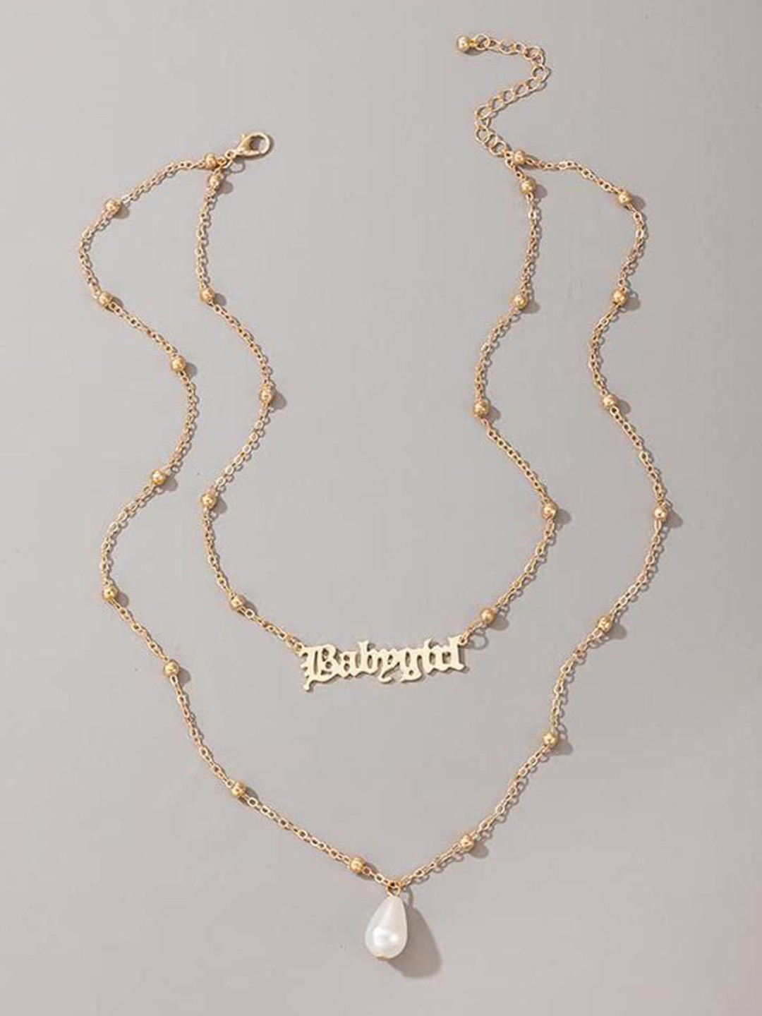 DESTINY JEWELS Brass Gold-Plated Pearl Beaded Babygirl Letter Layered Chain