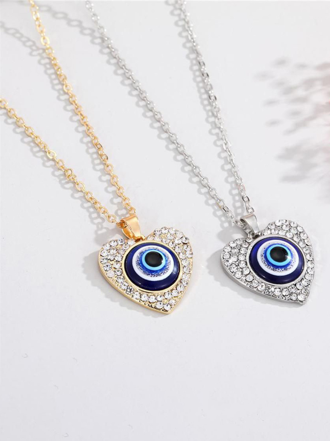 DESTINY JEWELS Set Of 2 Silver Plated & Gold Plated Heart Shaped Evil Eye Pendants & Chain
