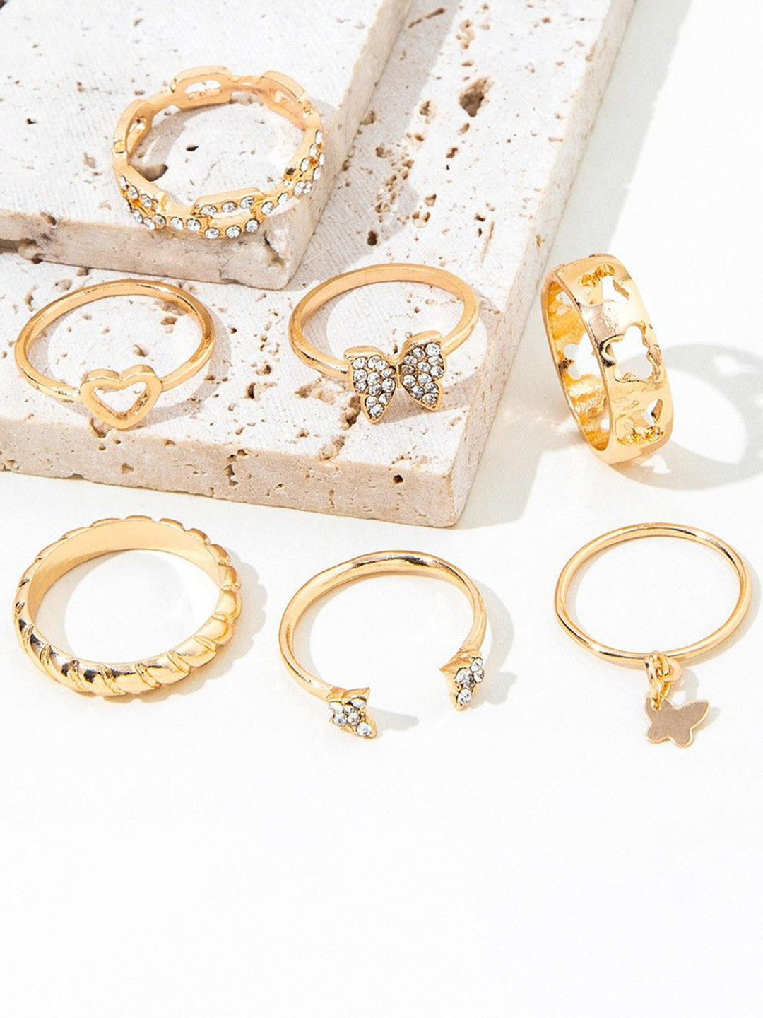 DESTINY JEWELS Set Of 7 Gold Plated Artificial Stone Studded Textured Finger Rings