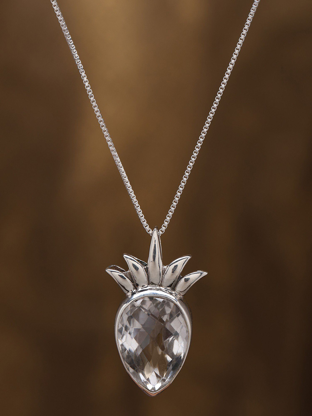 Exotic India Sterling Silver Pendant with Inverted Tear Drop Crystal