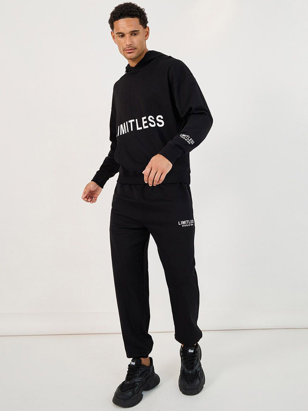 Styli Men Oversized Fit Hoodie and Jogger Co-ords with Placement Graphic