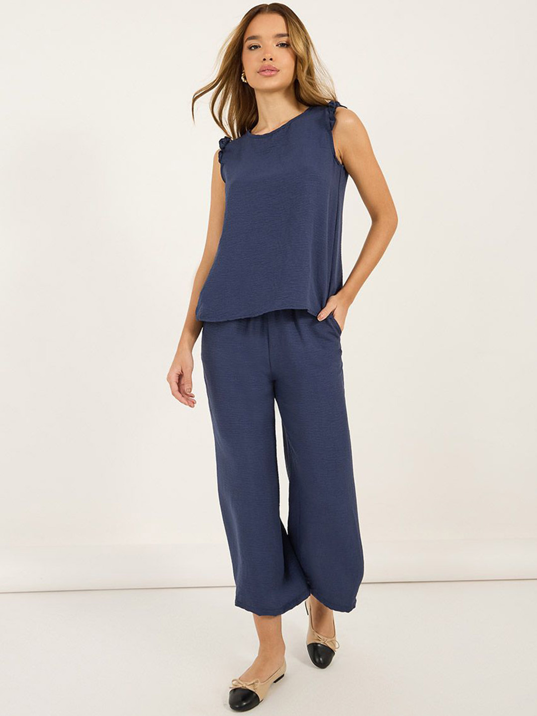 Styli Women Sleeveless Blouse With Back Buttons & Wide Leg Pants Co-Ord Set