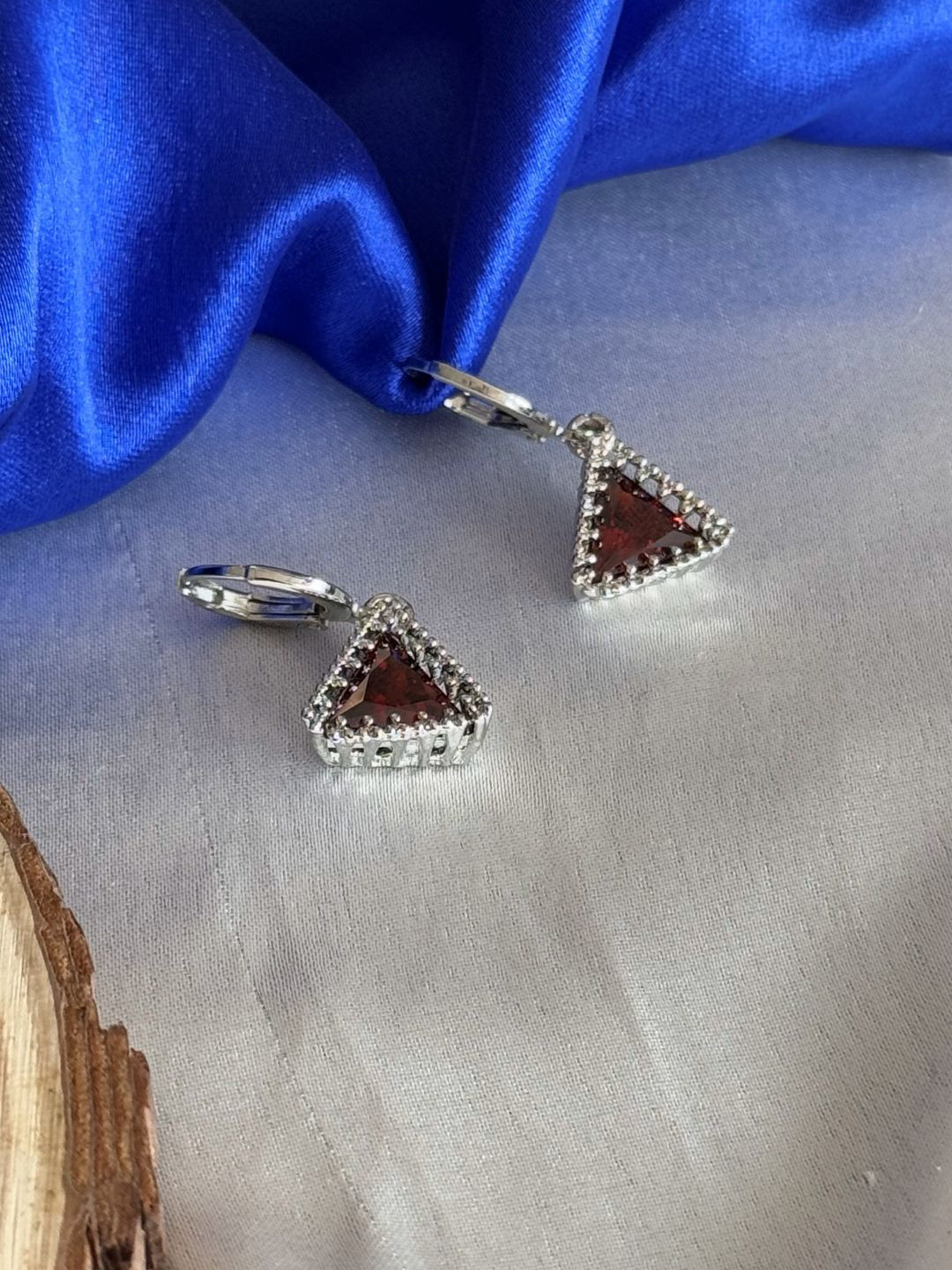 The Jewellery Tale Silver-Plated Artificial Stones Studded Triangular Shaped Drop Earrings