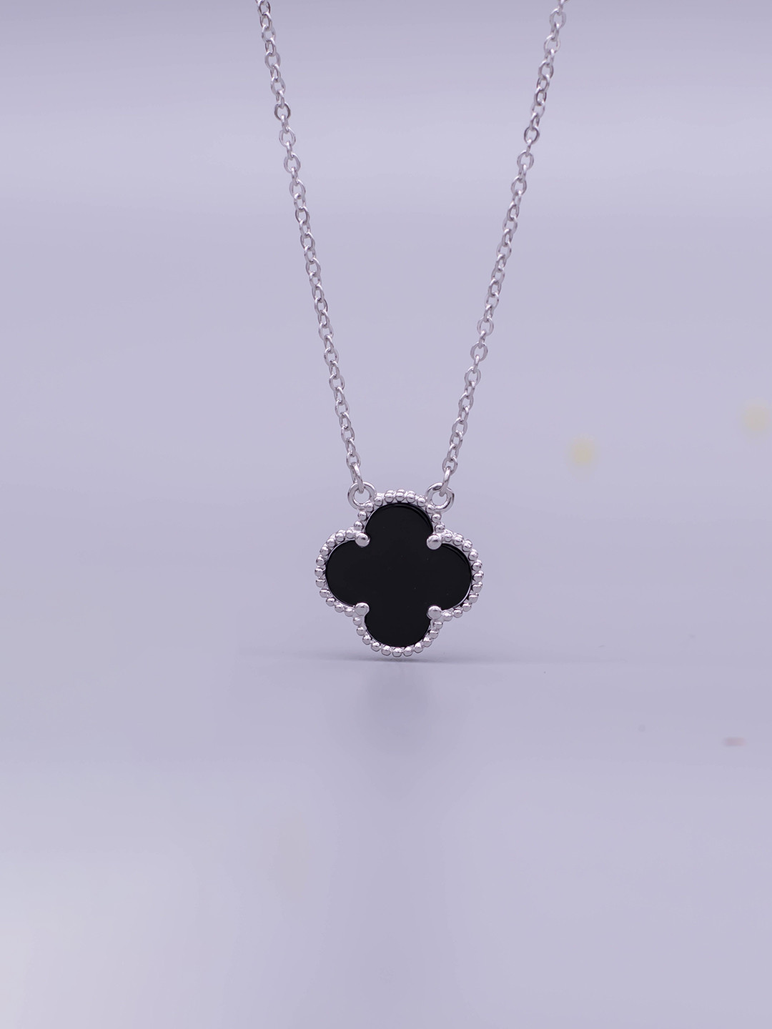 SILMORA Silver-Plated Floral Shaped Onyx Studded Pendant with Chain