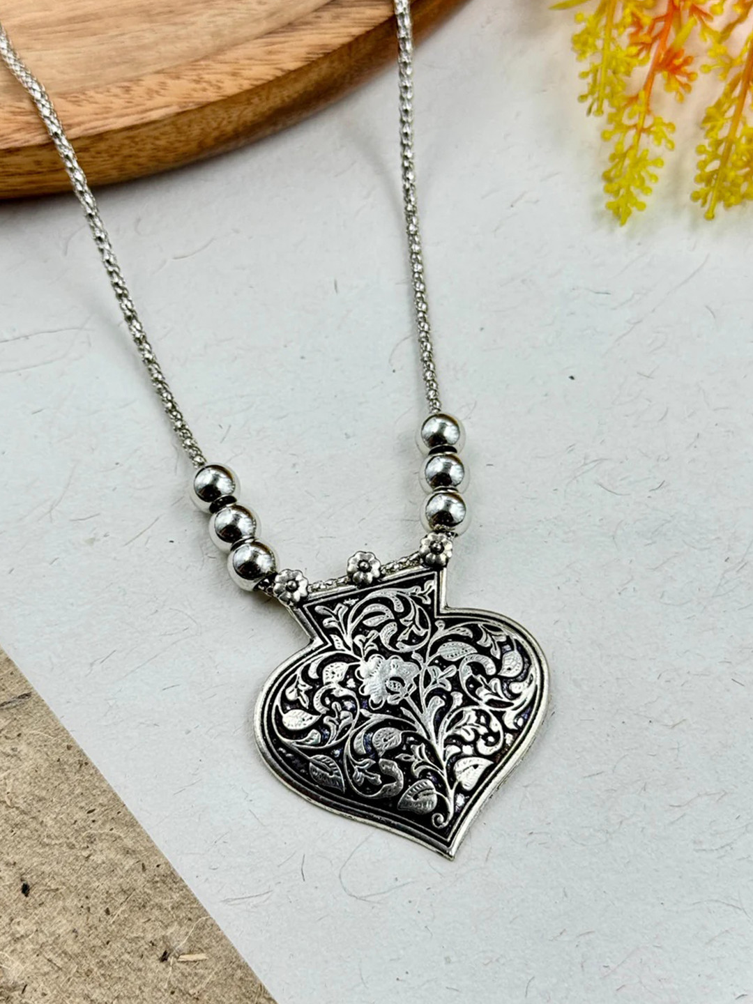 NAMAN ARTS Silver-Plated Heart Shaped Oxidised Pendant With Chain