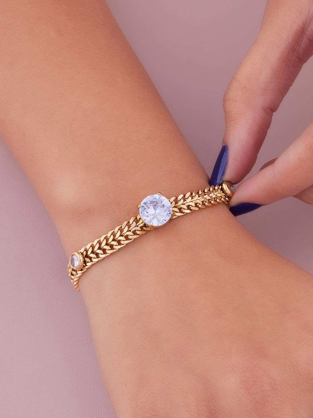 ANJNI CREATION Gold-Plated AD Studded Stainless Steel Tarnish-Free Soliter Star Bracelet