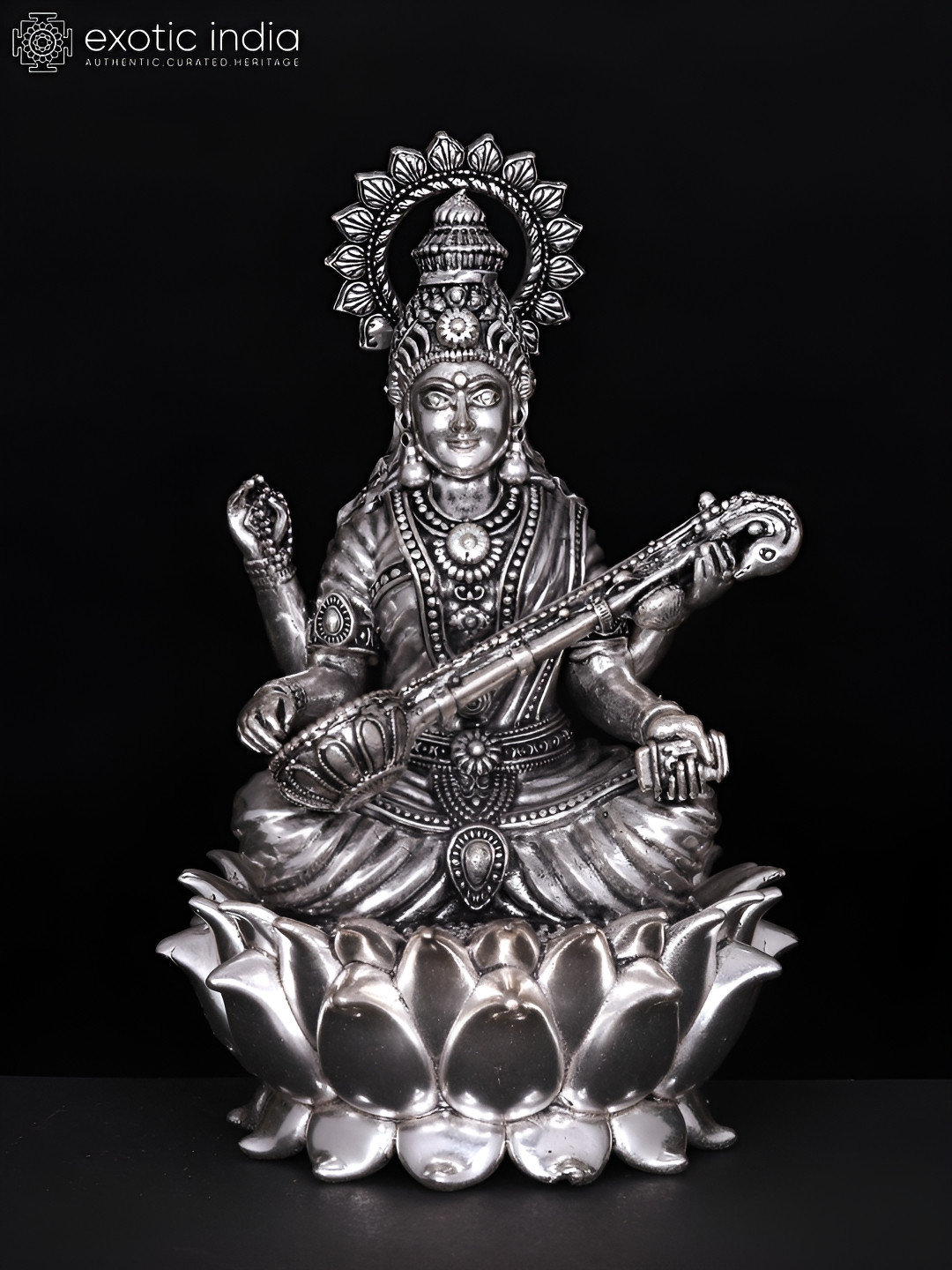 Exotic India Devi Saraswati Seated On Lotus Silver Brass Metallic Living Room Small Showpiece - 6.3 Inches