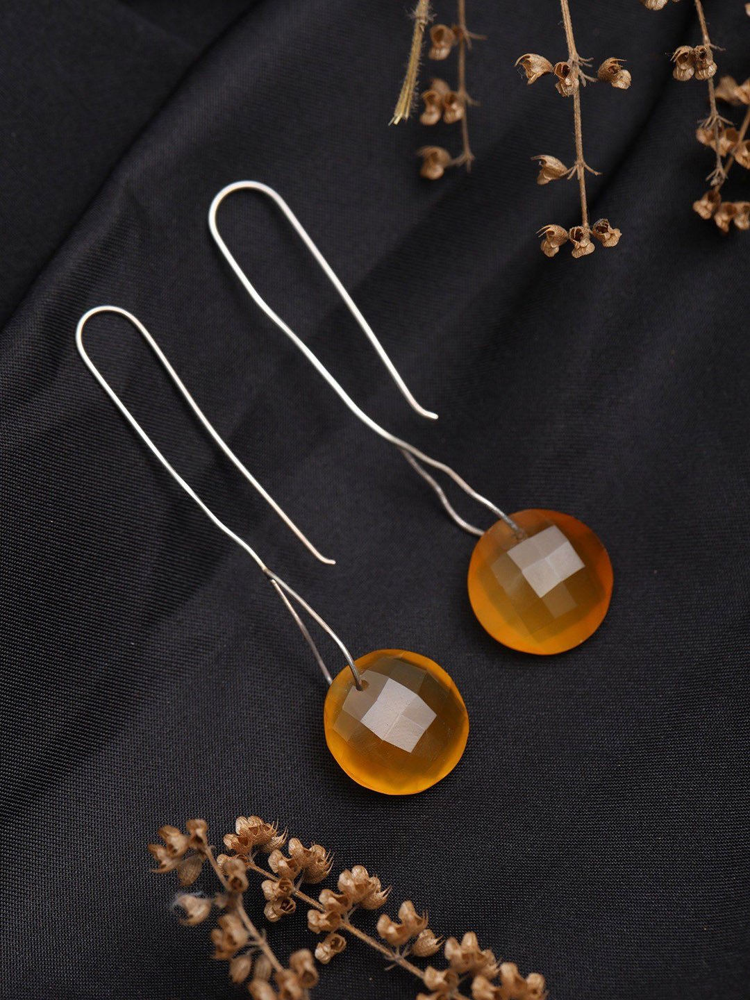 Exotic India Sterling Silver Hook Earrings with Faceted Round Carnelian