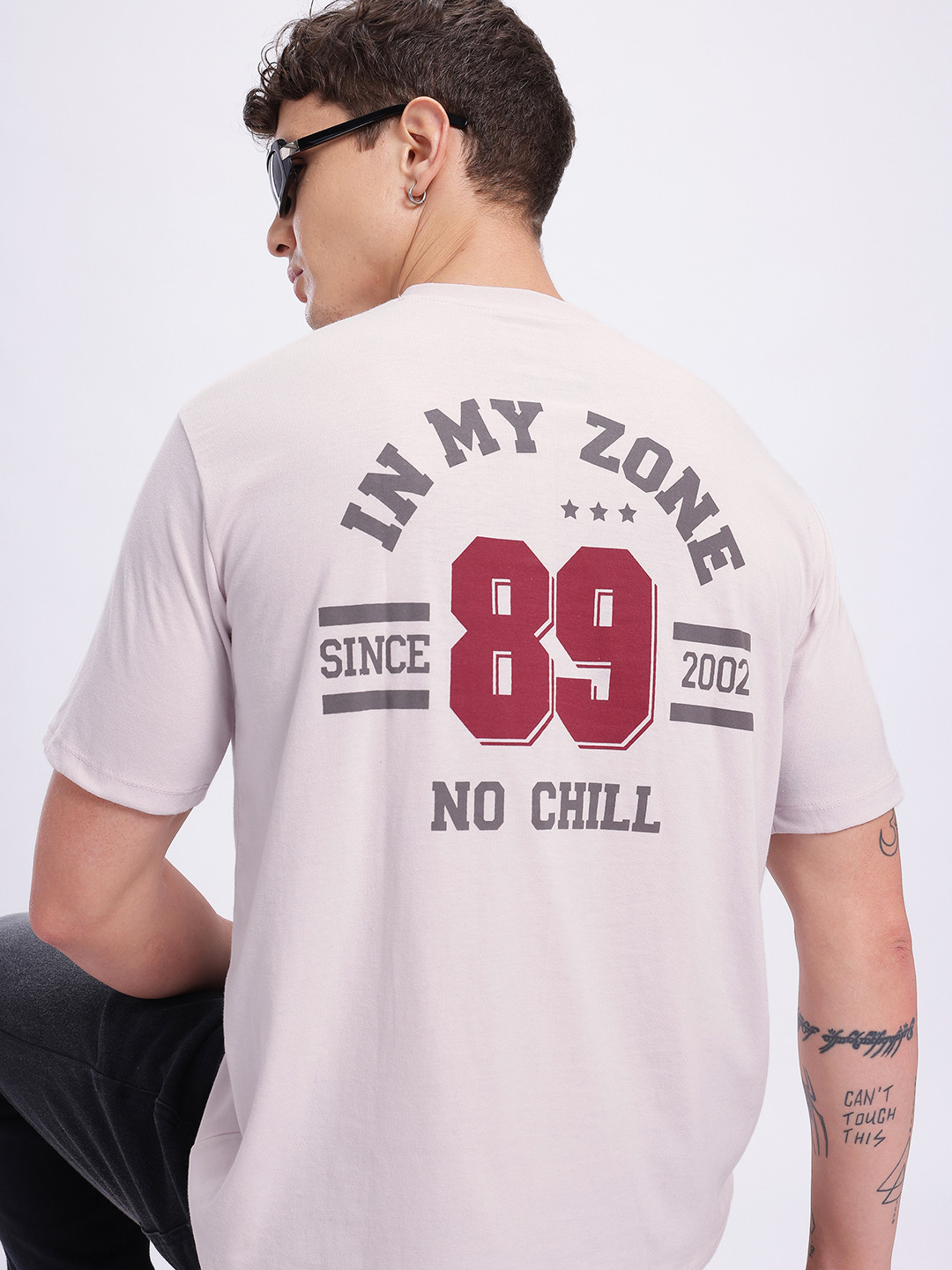 glitchez Men Typography Printed Drop-Shoulder Sleeves Oversized T-shirt with Front Seam