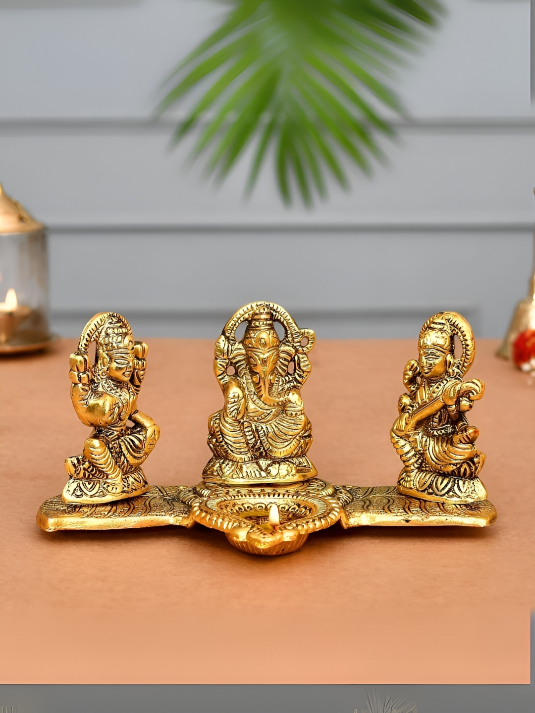 CraftVatika Gold-Toned Textured Laxmi Ganesh Saraswati Metal Diya