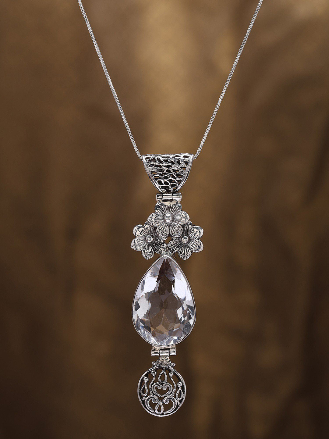 Exotic India Floral Sterling Silver Pendant with Teardrop Shaped Crystal Gemstone