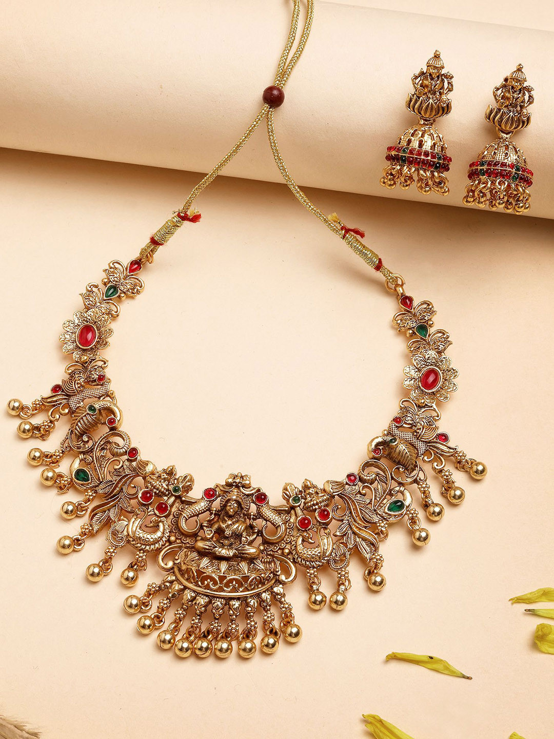KARATCART Gold-Plated Stone Studded & Beaded Laxmi Mata and Peacock Temple Jewellery Set