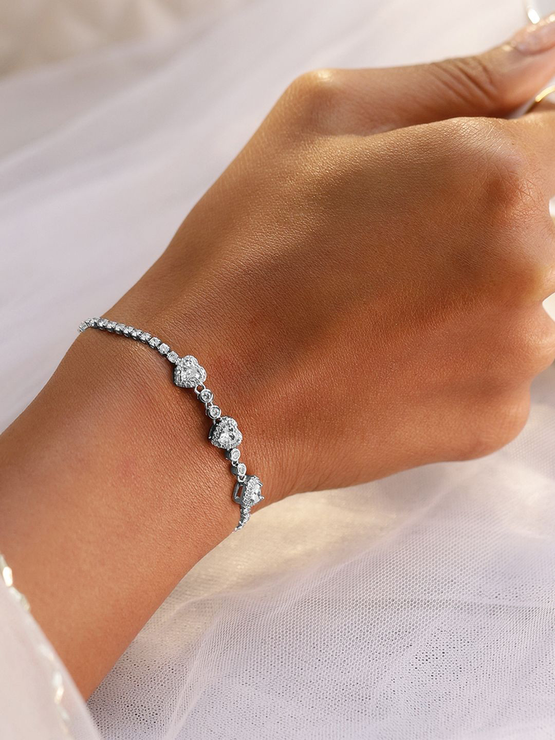 Rubans Rhodium Plated Triple Heart Cubic Zirconia Adjustable Pull Chain Tennis Bracelet