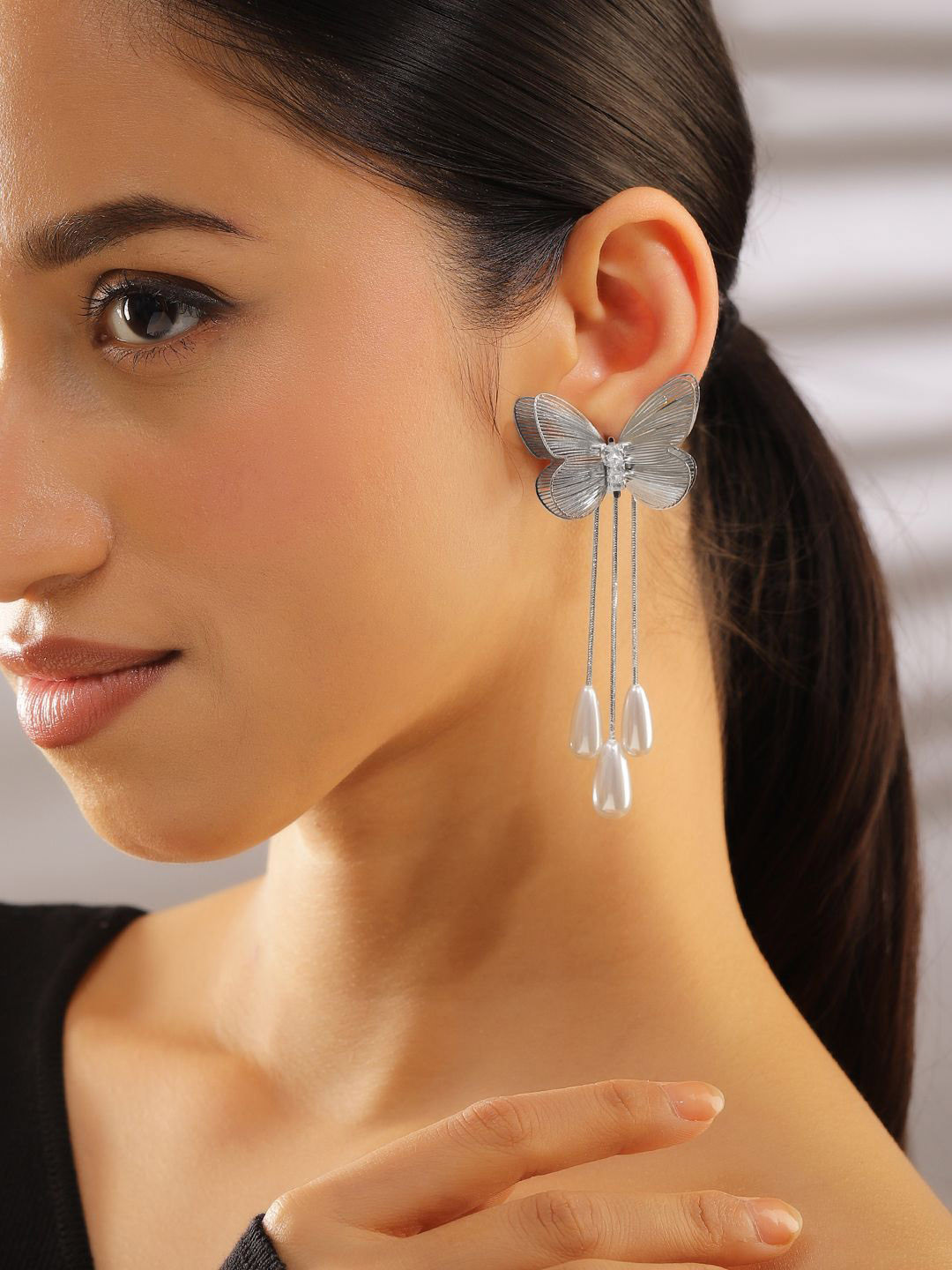 Rubans Rhodium Plated Butterfly Design White Pearl Drop Statement Earrings