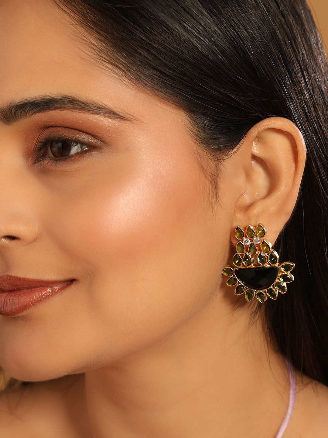 Nuyug  22K Gold Plated Dark Crystal Studded Contemporary Floral Shaped Stud Earrings