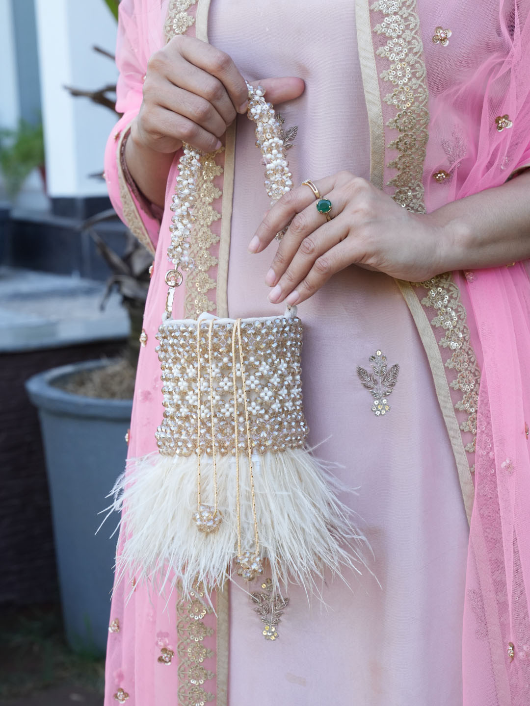 Chiaro Women pemium Embellished Potli Clutch With Feather