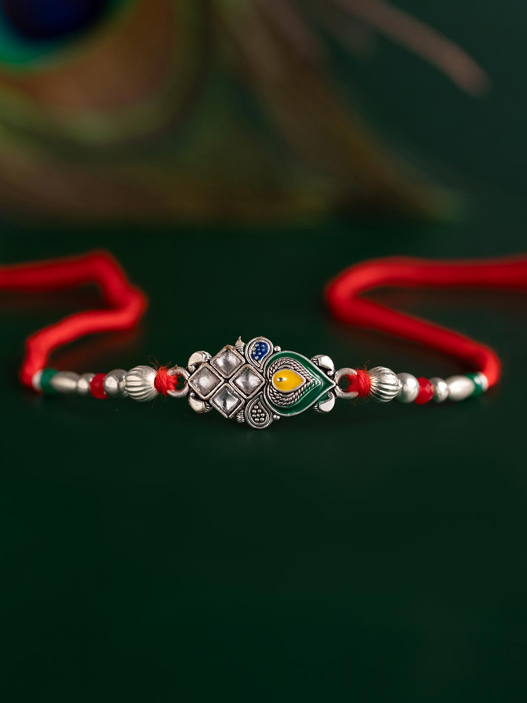 Regal Kundan Peacock Feather Thread Rakhi For Brother
