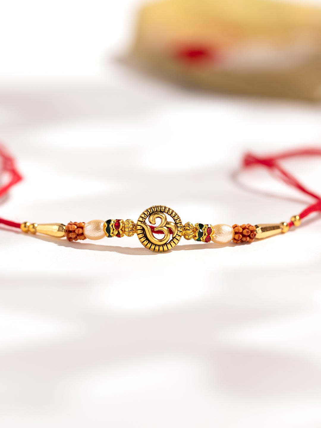 Voylla Devotional Om Beaded Thread Rakhi With Roli Chawal