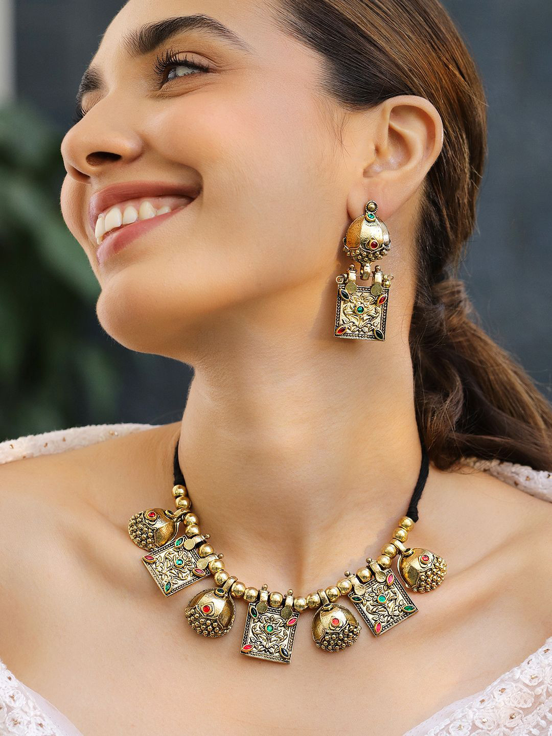 Rubans Oxidised Antique Gold-Plated Tribal Necklace Set with Dome Accent & Red-Green Stone